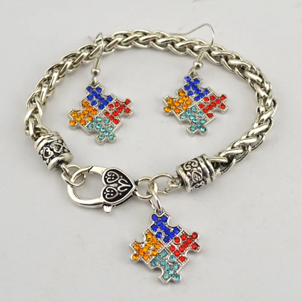 

Fashion rhodium plated zinc studded with sparkling crystals Autism Awareness Puzzle Piece pendant Bracelet Earring set