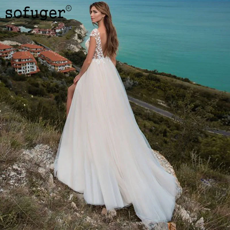 White Ivory Beach Tulle Appliques Cap Sleeves Wedding Dresses Bridal Gown Wedding Vestidos de Noivas Custom 
White Ivory Beach Tulle Appliques Cap Sleeves Wedding Dresses Bridal Gown Wedding Vestidos de Noivas Custom