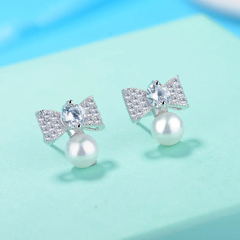 Genuine pearl 925 silver Bowknot plated with cubic zircon Earrings European fine jewelry making for women gifts on sale
Genuine pearl 925 silver Bowknot plated with cubic zircon Earrings European fine jewelry making for women gifts on sale