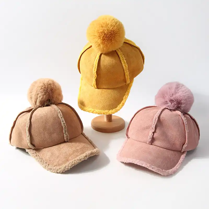 fitted hat with fur ball