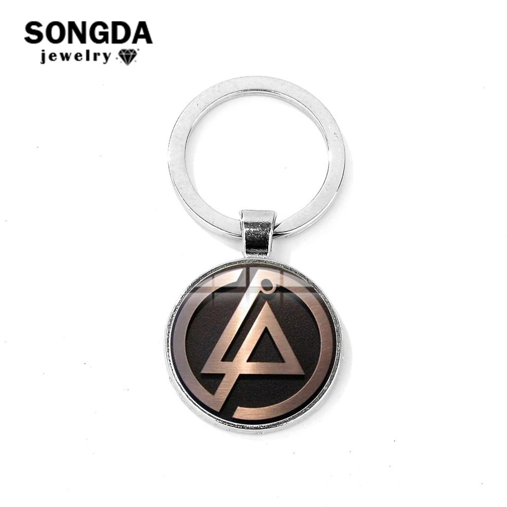 SONGDA ROCK Music Linkin Park Band Sign Keychain Art Logo Glass Cabochon Silver Plated Metal Bag Car Key Chain Ring Handcrafteds
SONGDA ROCK Music Linkin Park Band Sign Keychain Art Logo Glass Cabochon Silver Plated Metal Bag Car Key Chain Ring Handcrafteds
