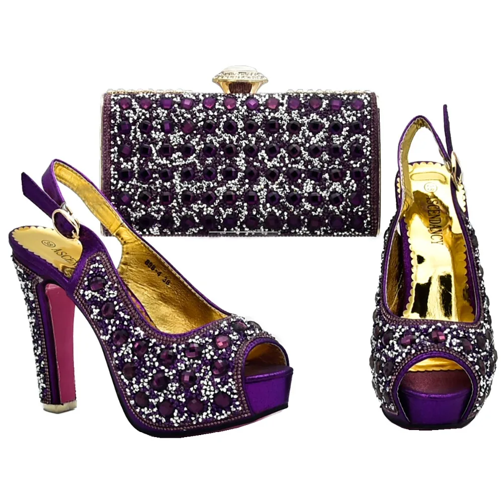 Purple rhinestones shinning shoes and bag for women to match tulle lace dress shoe bag set african aso ebi shoes bag SB8130-2
Purple rhinestones shinning shoes and bag for women to match tulle lace dress shoe bag set african aso ebi shoes bag SB8130-2