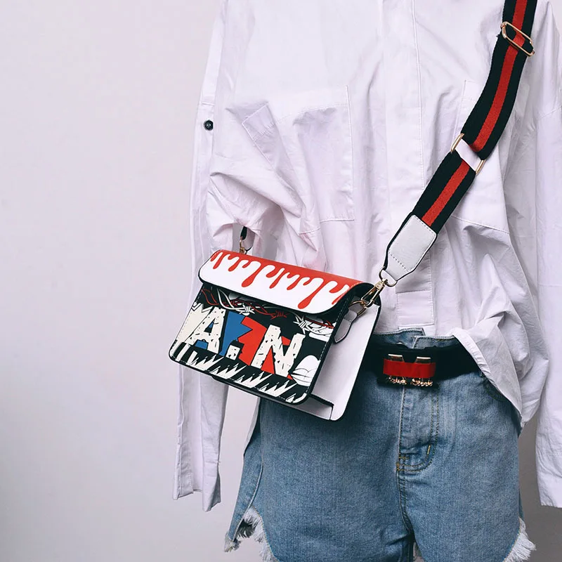 A new spring an the wind hit the color printing bag small package graffiti ribbon Shoulder Messenger Bag funny tide
A new spring an the wind hit the color printing bag small package graffiti ribbon Shoulder Messenger Bag funny tide