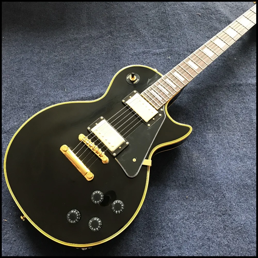 black color Chinese Vicers electric guitar with gold color hardware ,with yellow binding and logo, high quality Chinese guitarra
black color Chinese Vicers electric guitar with gold color hardware ,with yellow binding and logo, high quality Chinese guitarra