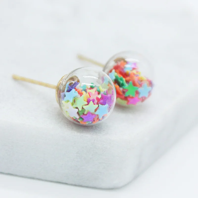 2019 latest design brand jewelry 10MM glass ball filled with Colored star fragments earrings for women .
2019 latest design brand jewelry 10MM glass ball filled with Colored star fragments earrings for women .
