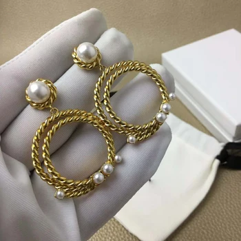 Twisted pearl-inlaid double circle Earrings Named temperament Earrings 
Twisted pearl-inlaid double circle Earrings Named temperament Earrings