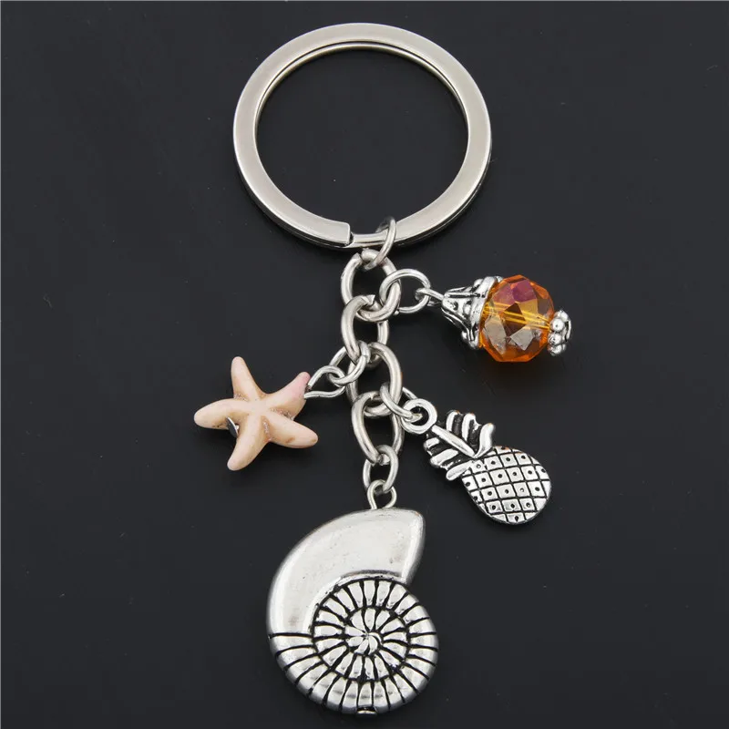 1pc Shell Starfish Key Chain Key Ring Silver Pineapple Keychains For Car Metal Pendant Bag Charm Keyring Summer Jewelry E1684
1pc Shell Starfish Key Chain Key Ring Silver Pineapple Keychains For Car Metal Pendant Bag Charm Keyring Summer Jewelry E1684