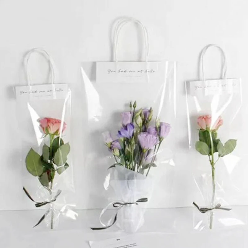 New Hot Florist Decoration Long Tote PVC Clear Bag Flower Bouquet Bagging Portable Transparent Gift Bag Collocation Packaging
New Hot Florist Decoration Long Tote PVC Clear Bag Flower Bouquet Bagging Portable Transparent Gift Bag Collocation Packaging