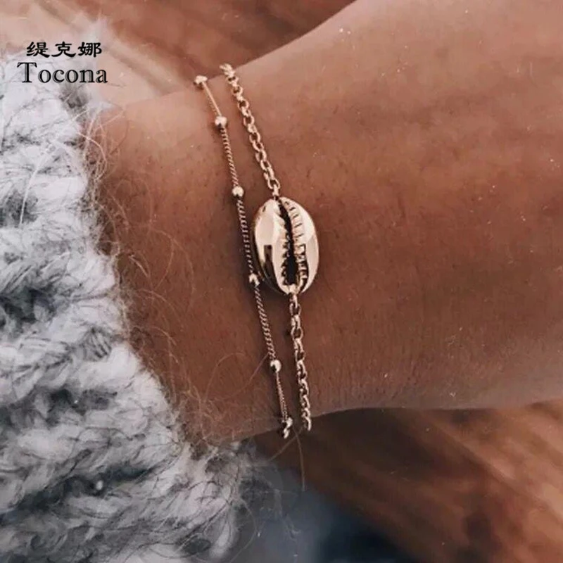 Tocona 2 Pcs/set Bohemia New Fashion Gold Color Summer Shell Chain Bracelets Bangles Multi-layer Jewelry Women Wholesale 3699
Tocona 2 Pcs/set Bohemia New Fashion Gold Color Summer Shell Chain Bracelets Bangles Multi-layer Jewelry Women Wholesale 3699