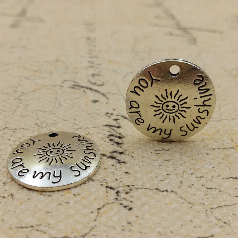 High Quality 20 Pieces/Lot Diameter 22mm Antique Silver Plated You Are My Sunshine Round Disc Words Charms For Jewelry Making
High Quality 20 Pieces/Lot Diameter 22mm Antique Silver Plated You Are My Sunshine Round Disc Words Charms For Jewelry Making