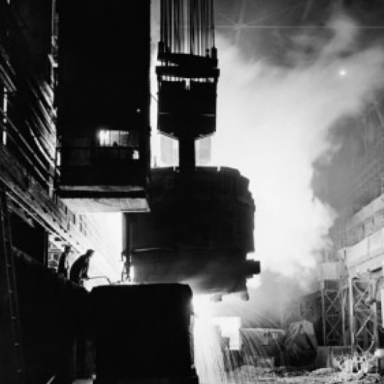 Molten steel being poured into ingot molds in a steel factory Poster Print (24 x 36)