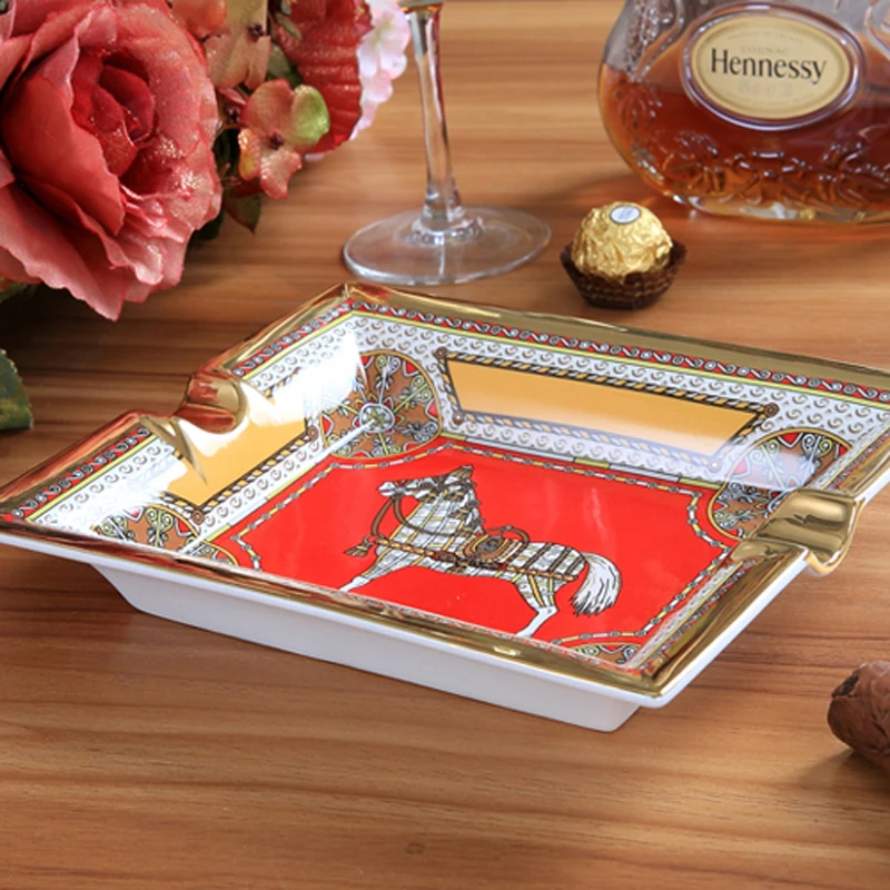 Porcelain ashtray bone china god horse design red color outline in gold rectanglar shape ashtray cigarette ashtray business gift
Porcelain ashtray bone china god horse design red color outline in gold rectanglar shape ashtray cigarette ashtray business gift