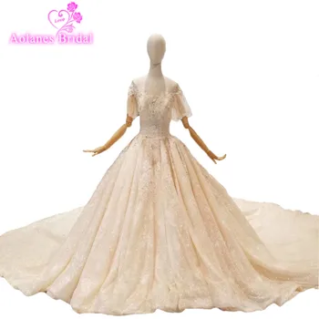 2018 New Champagne Lace Appliques Scoop Cathedral Train Bridal Gowns Ball Gown Short Lantern Sleeve Backless Wedding Dresses
2018 New Champagne Lace Appliques Scoop Cathedral Train Bridal Gowns Ball Gown Short Lantern Sleeve Backless Wedding Dresses