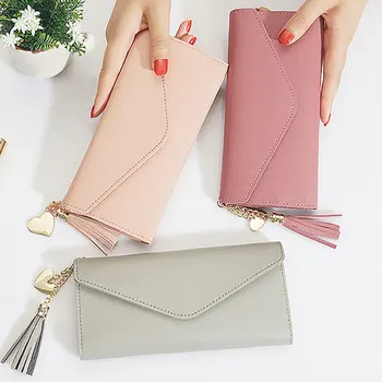 Fashion new wallet ladies long Japanese and Korean style student wallet fashion simple love tassel buckle wallet 
Fashion new wallet ladies long Japanese and Korean style student wallet fashion simple love tassel buckle wallet