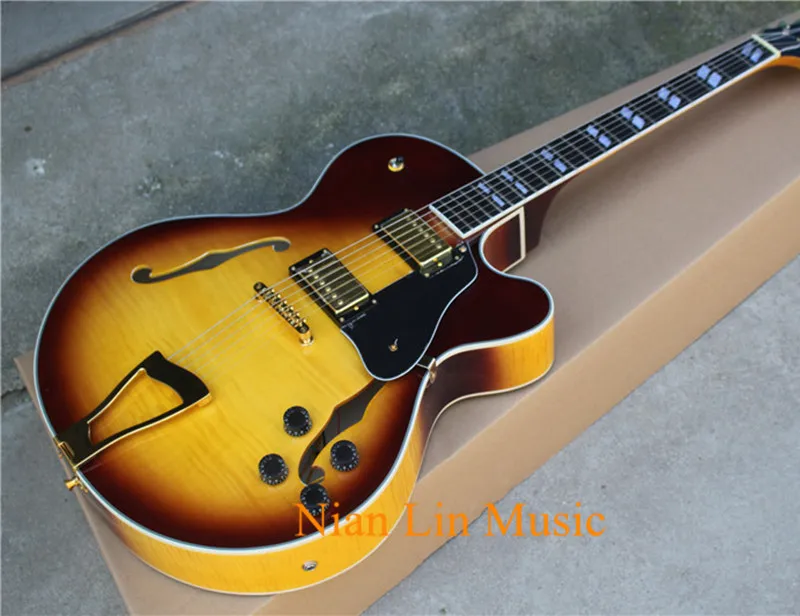 6-String Electric Guitar,Semi-hollow Body with Tobacco Color,Gold Hardware,Flame Maple Veneer,White Binding,can be Custom
6-String Electric Guitar,Semi-hollow Body with Tobacco Color,Gold Hardware,Flame Maple Veneer,White Binding,can be Custom
