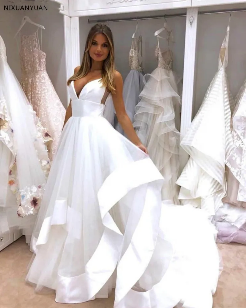 Sexy Spaghetti Straps Open Back Wedding Dress 2019 White Satin Ruffles Puffy Tulle A-line Beach Bridal Gowns Wedding Gown
Sexy Spaghetti Straps Open Back Wedding Dress 2019 White Satin Ruffles Puffy Tulle A-line Beach Bridal Gowns Wedding Gown