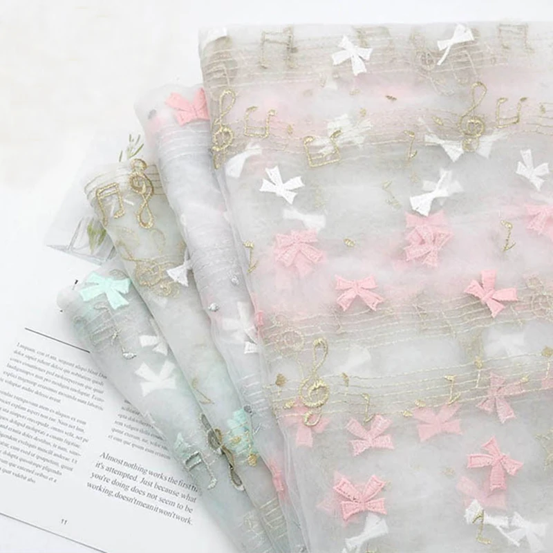 130CMX100CM Soft Mesh Embroidery Musical Note Bowknot Tulle Fabric for Skirt Wedding Party Stage Dress DIY Tulle Material
130CMX100CM Soft Mesh Embroidery Musical Note Bowknot Tulle Fabric for Skirt Wedding Party Stage Dress DIY Tulle Material