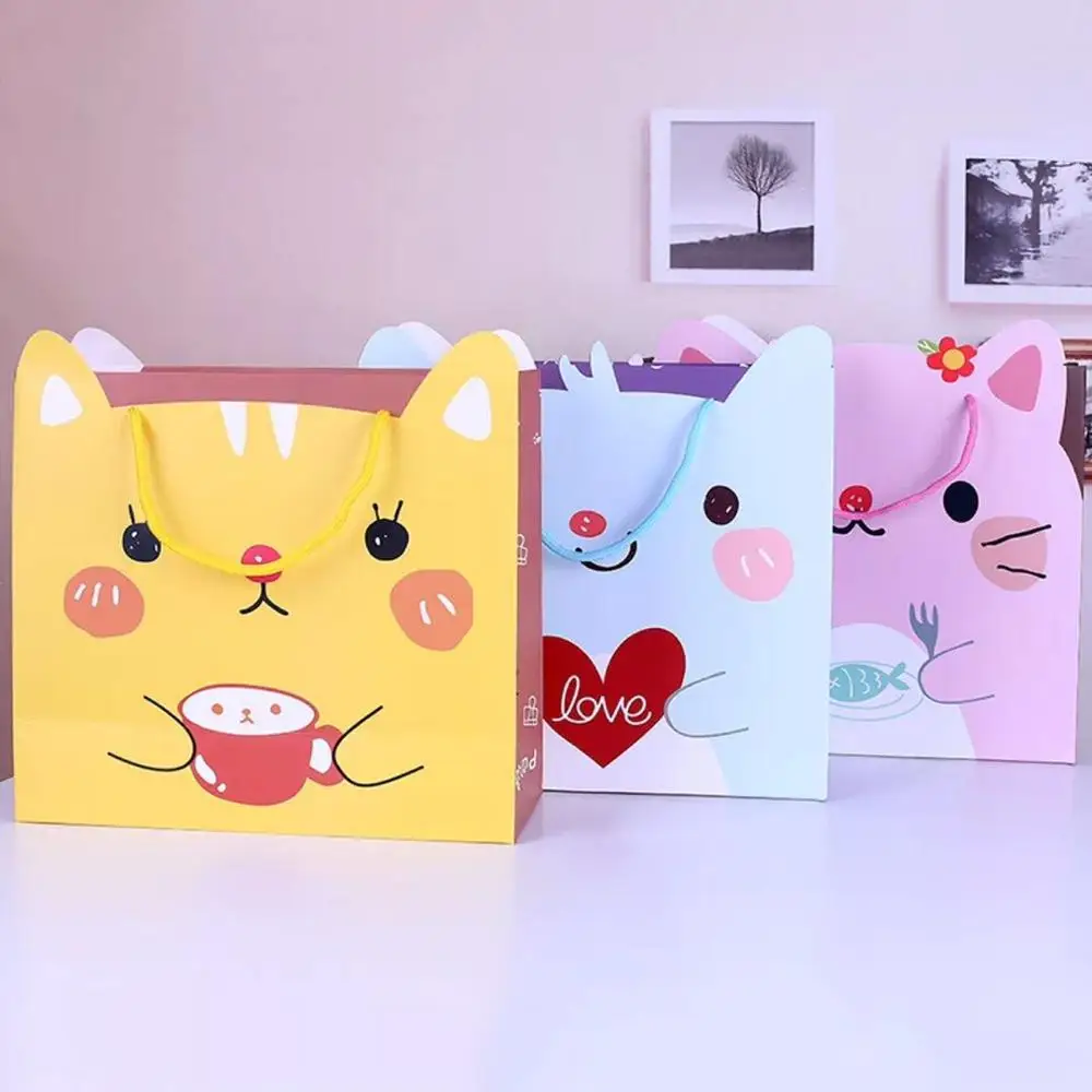 Emerra Hot Selling Cartoon Kitty Gift Bag Color Candy hand-held paper bag kids toys Clothing Packaging Wholesale Free Shipping
Emerra Hot Selling Cartoon Kitty Gift Bag Color Candy hand-held paper bag kids toys Clothing Packaging Wholesale Free Shipping