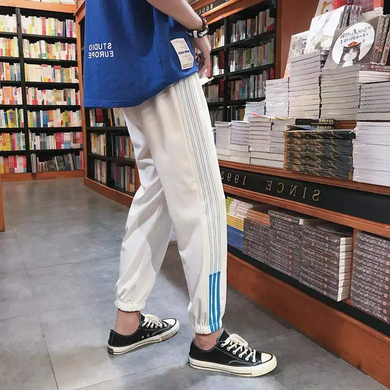 New Harajuku pants loose beam legs solid color Ankle-Length Pants women couple Harem Pants hip hop fashion large size S-2XL
New Harajuku pants loose beam legs solid color Ankle-Length Pants women couple Harem Pants hip hop fashion large size S-2XL