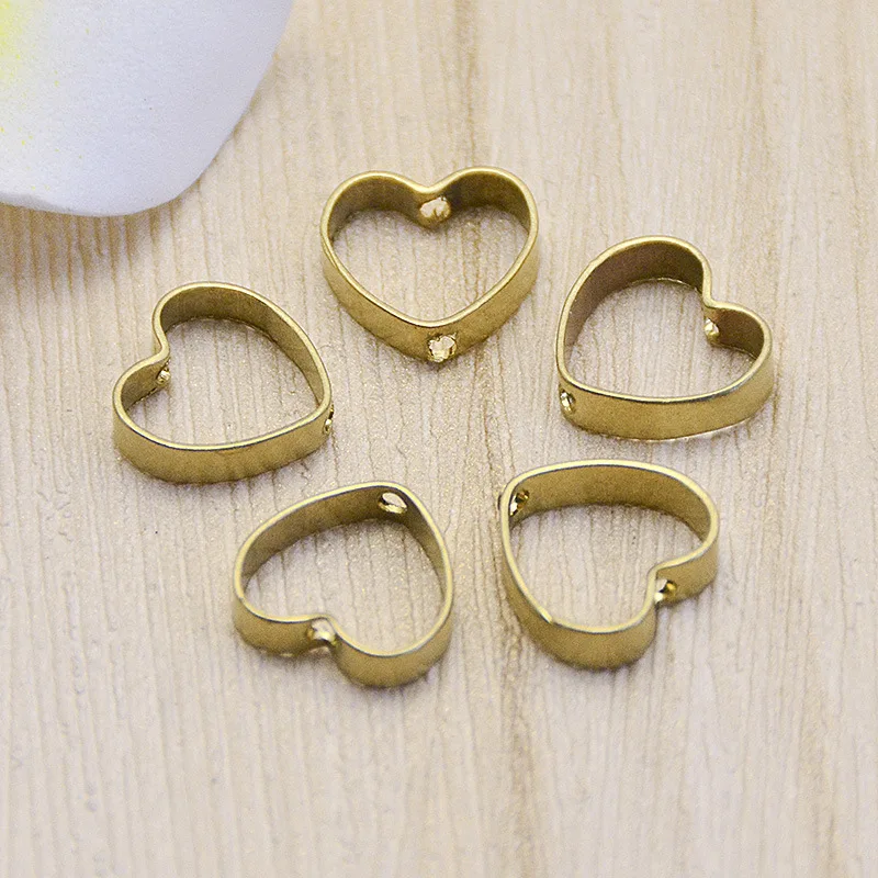 50PCS 13*14mm Copper Material Hollow Heart Connector Charm Heart Pendant for Earring Necklace DIY Handmade Jewelry Making
50PCS 13*14mm Copper Material Hollow Heart Connector Charm Heart Pendant for Earring Necklace DIY Handmade Jewelry Making
