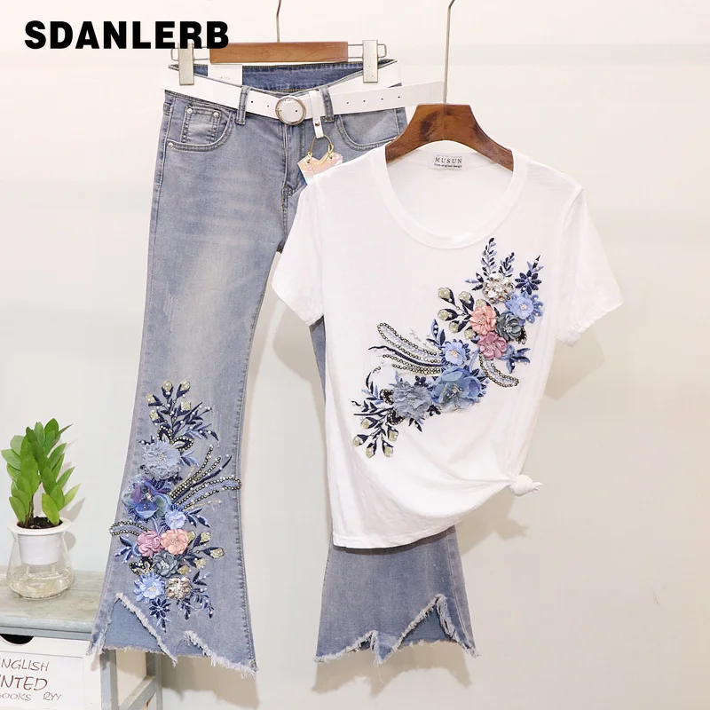 Spring Summer New Flare Jeans Set Studded Embroidery Flower Cotton T-shirt + Jean Two-piece Lady Ripped Denim Pants Suit Women
Spring Summer New Flare Jeans Set Studded Embroidery Flower Cotton T-shirt + Jean Two-piece Lady Ripped Denim Pants Suit Women