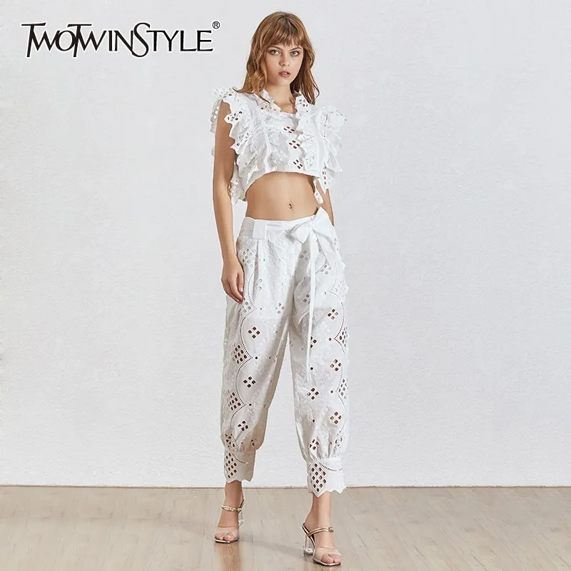 TWOTWINSTYLE Casual Hollow Out Women Two Piece Set Sleeve Sleeveless Tops High Waist Ankle Length Pants Female Suit Summer 2019
TWOTWINSTYLE Casual Hollow Out Women Two Piece Set Sleeve Sleeveless Tops High Waist Ankle Length Pants Female Suit Summer 2019