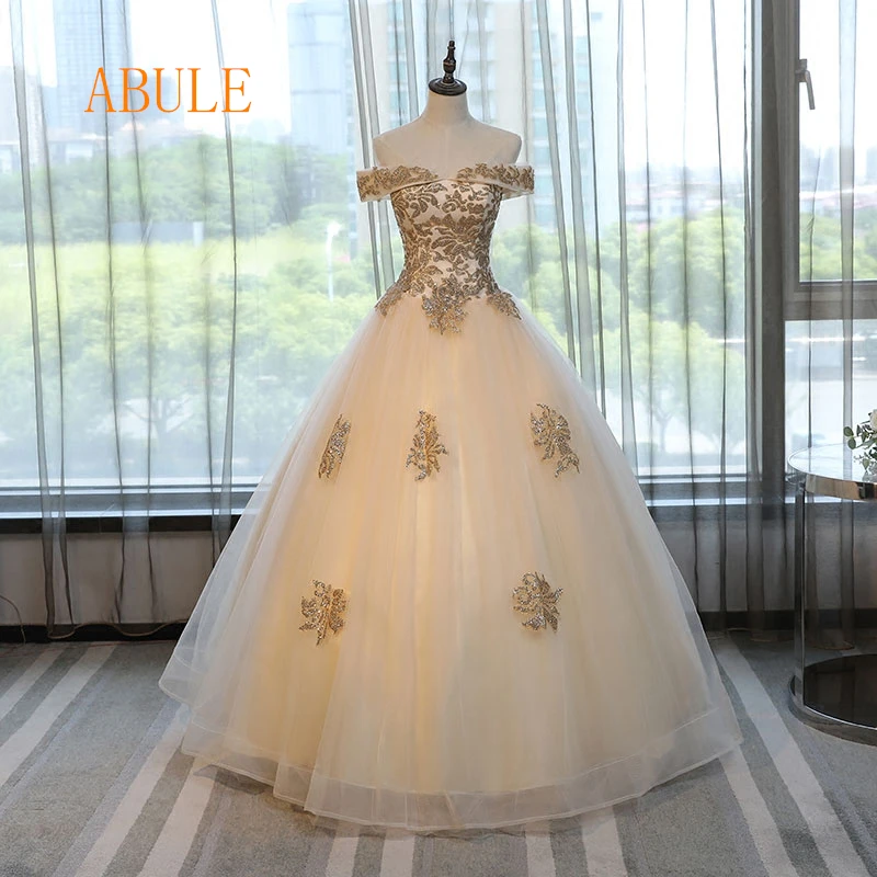 ABULE Quinceanera Dresses 2019 srtapless lace up Gold ball gown prom dress Debutante Gown 15 Years Layer Tulle Custom sizes
ABULE Quinceanera Dresses 2019 srtapless lace up Gold ball gown prom dress Debutante Gown 15 Years Layer Tulle Custom sizes