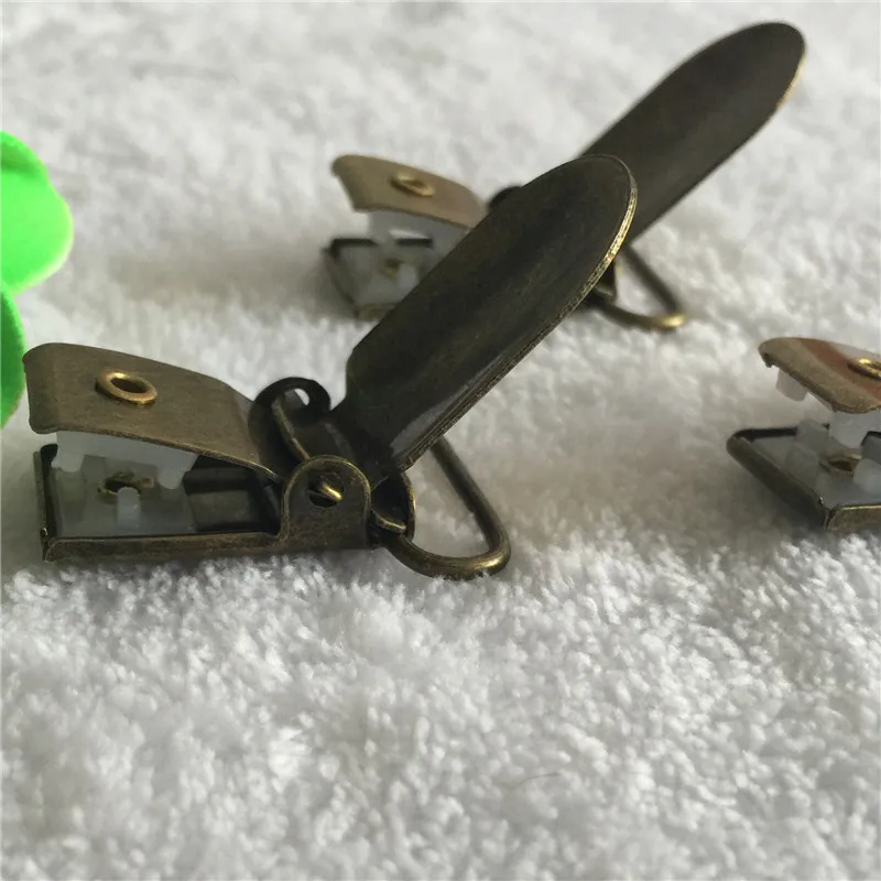 20mm 5PCS Baby Pacifier Clips Holder Antique Bronze Metal Suspender Paci Holders Infant Soother Clasps Funny Accessories plastic
20mm 5PCS Baby Pacifier Clips Holder Antique Bronze Metal Suspender Paci Holders Infant Soother Clasps Funny Accessories plastic