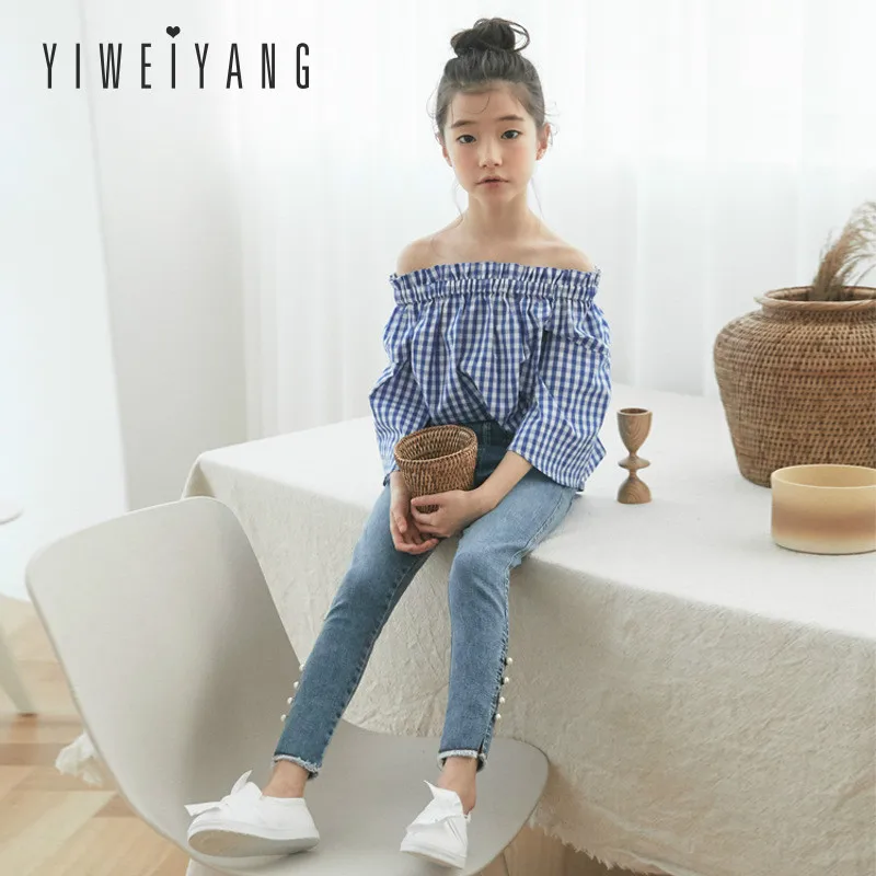 Summer 2019 One Word Collar Bell Sleeve Girl's Blouse Fashion Leisure Korean Pure Cotton Checked Shirt Parent Child Clothing
Summer 2019 One Word Collar Bell Sleeve Girl's Blouse Fashion Leisure Korean Pure Cotton Checked Shirt Parent Child Clothing