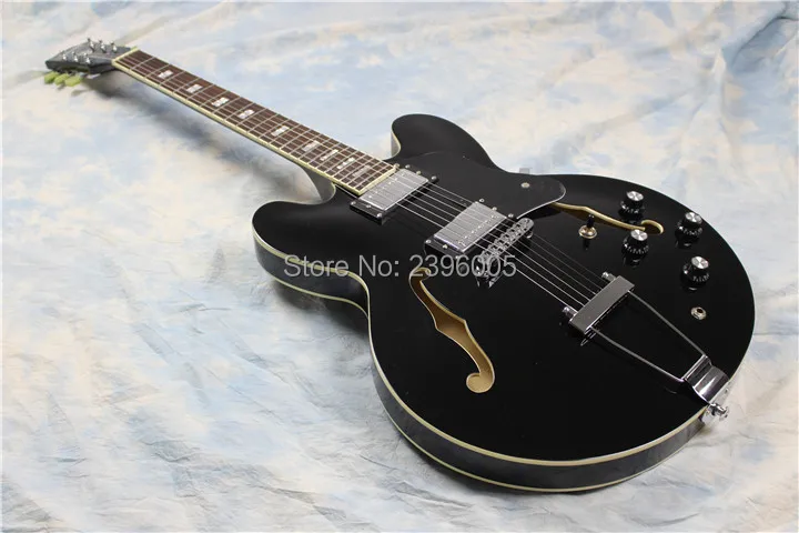 Factory direct black semi hollow guitar,real guitar picture,double F holes version,chrome hardware,free shipping
Factory direct black semi hollow guitar,real guitar picture,double F holes version,chrome hardware,free shipping