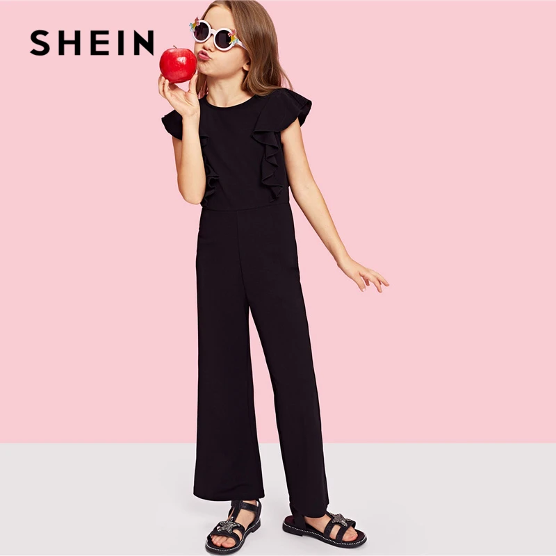 SHEIN Kiddie Black Ruffle Trim Zip Back Knot Button Wide Leg Casual Girls Jumpsuit 2019 Spring Elegant Cap Sleeve Kids Jumpsuits
SHEIN Kiddie Black Ruffle Trim Zip Back Knot Button Wide Leg Casual Girls Jumpsuit 2019 Spring Elegant Cap Sleeve Kids Jumpsuits