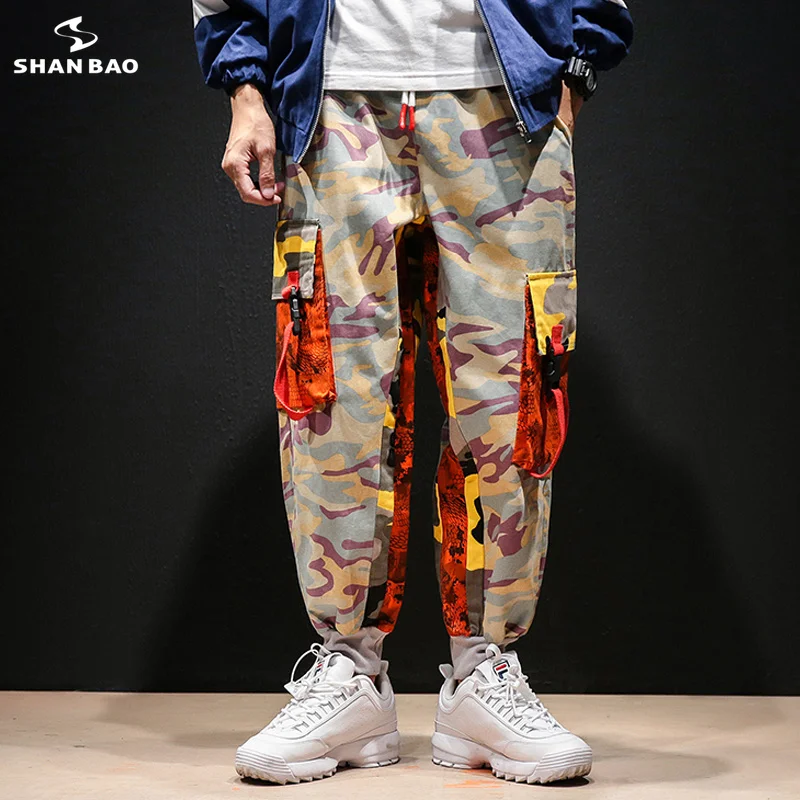 SHANBAO big pocket camouflage color matching stitching men's hip hop casual pants 2020 spring new trend high street loose pants
SHANBAO big pocket camouflage color matching stitching men's hip hop casual pants 2020 spring new trend high street loose pants