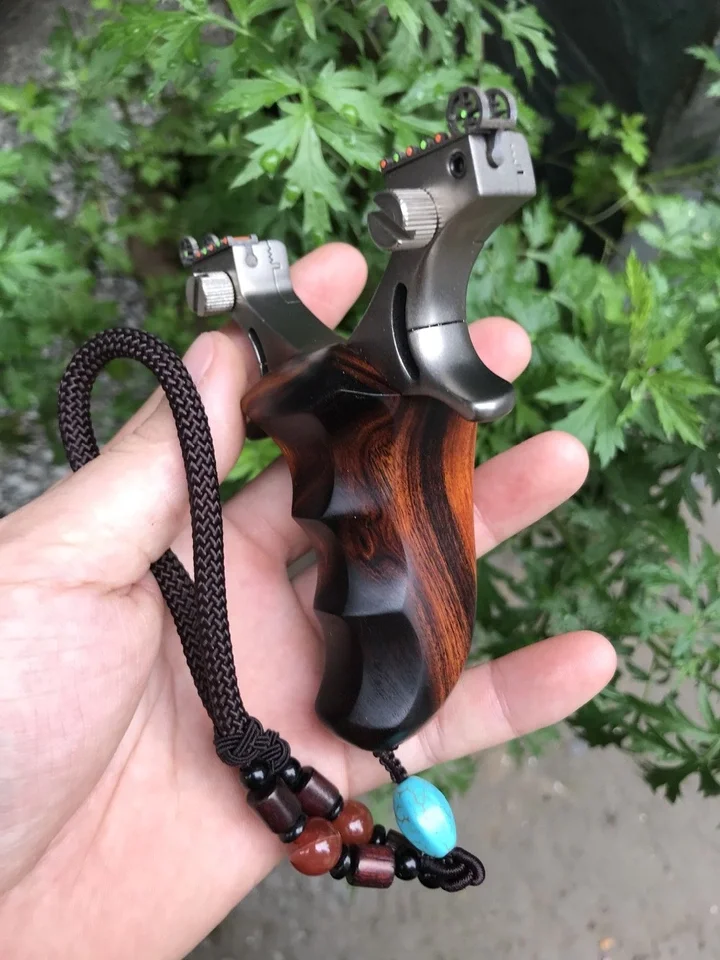 Titanium Alloy Flat Leather sling tc21 With Wooden Handle Slingshot for Slingshot Collectors Powerful Slingshot Catapult Bow
Titanium Alloy Flat Leather sling tc21 With Wooden Handle Slingshot for Slingshot Collectors Powerful Slingshot Catapult Bow