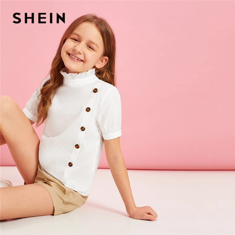 SHEIN Kiddie White Solid Frill Neck Button Front Girls Casual Blouse Teenagers 2019 Summer Short Sleeve Ruffle Kids Blouse Tops
SHEIN Kiddie White Solid Frill Neck Button Front Girls Casual Blouse Teenagers 2019 Summer Short Sleeve Ruffle Kids Blouse Tops