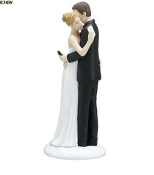 funny texting couple wedding cake toppers bride and bridegroom resin figurines 
funny texting couple wedding cake toppers bride and bridegroom resin figurines