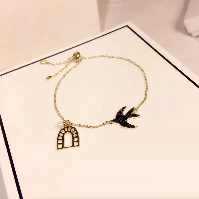 Pearl Copper Alloy Swallow Bird Charm Bracelet Window Women Wedding Pseudo Gold Flying Bird Enamel Chain Bracelet Party Jewelry
Pearl Copper Alloy Swallow Bird Charm Bracelet Window Women Wedding Pseudo Gold Flying Bird Enamel Chain Bracelet Party Jewelry