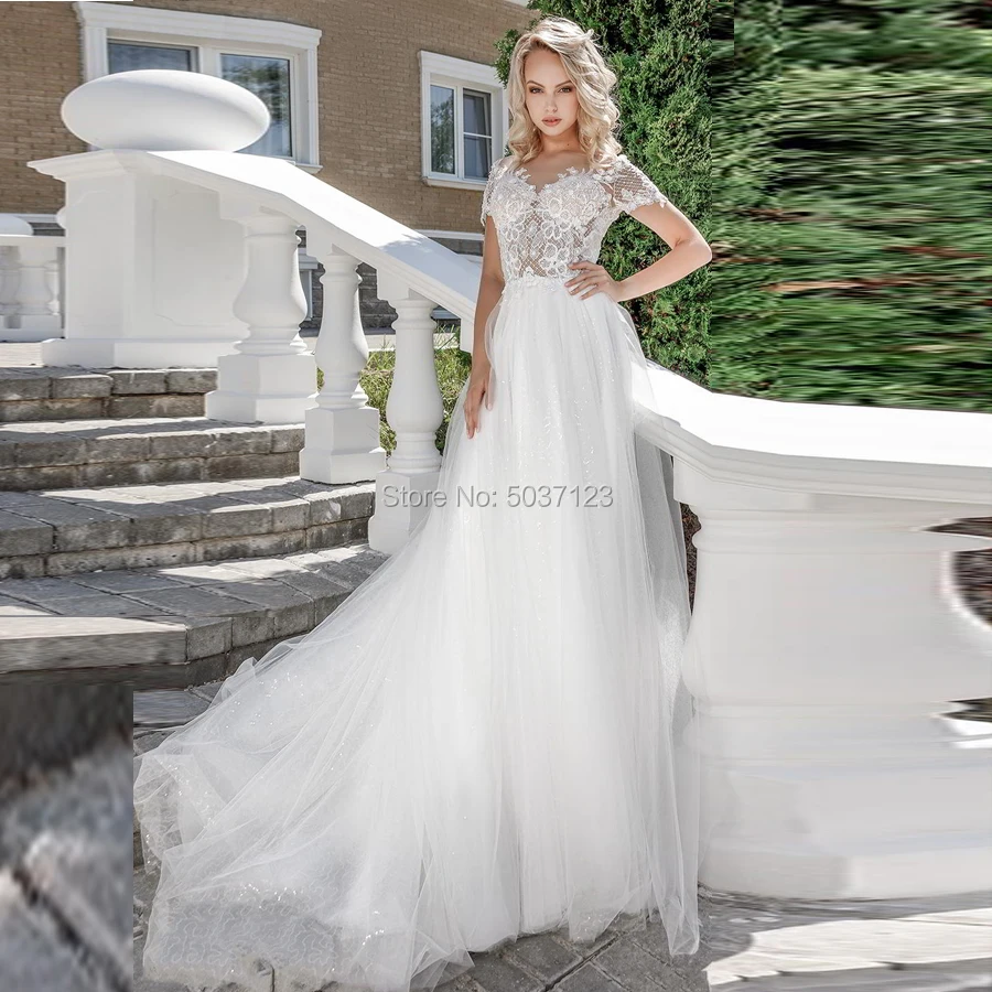 Short Sleeves A Line Tulle Wedding Dresses V Neck Lace Appliques Open Back Vestido De Noiva Bridal Gowns Robe De Mariee
Short Sleeves A Line Tulle Wedding Dresses V Neck Lace Appliques Open Back Vestido De Noiva Bridal Gowns Robe De Mariee