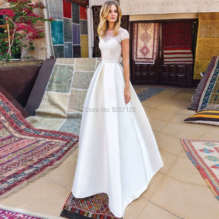 Satin A Line Wedding Dresses Vestido De Noiva Lace Appliques Cap Sleeves Short Sleeves Button Illusion Bridal Wedding Gown
Satin A Line Wedding Dresses Vestido De Noiva Lace Appliques Cap Sleeves Short Sleeves Button Illusion Bridal Wedding Gown