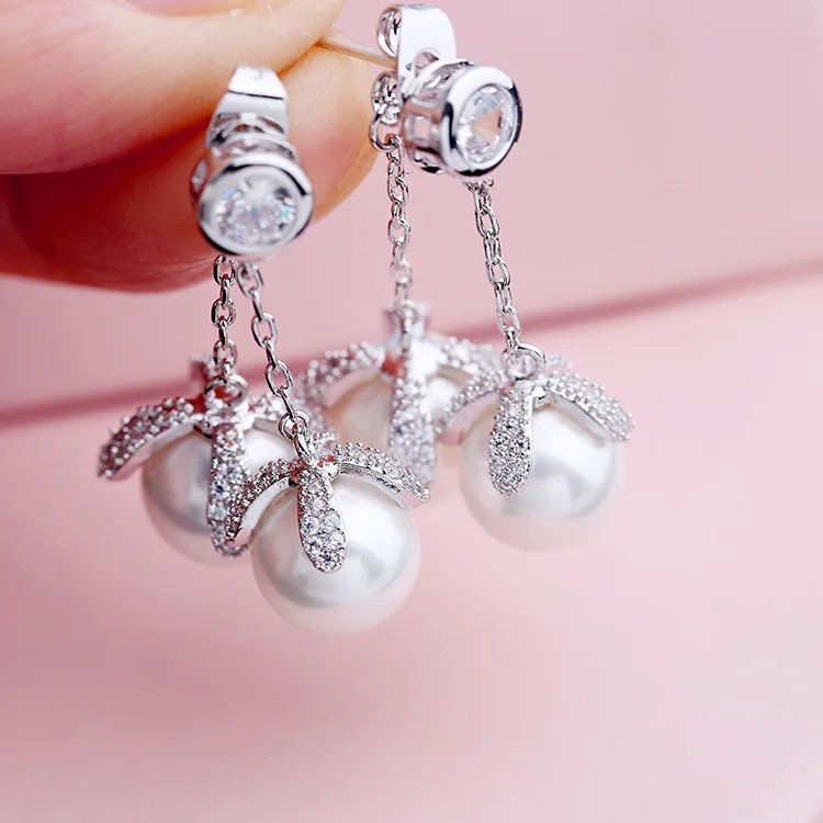 High quality micro inlaid zircon double pearl flower water drop after hanging dual purpose earrings for women
High quality micro inlaid zircon double pearl flower water drop after hanging dual purpose earrings for women