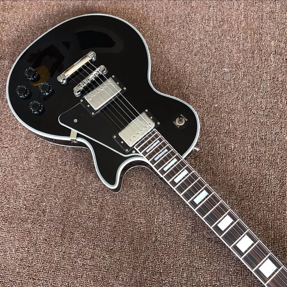 New arrive Chinese factory OEM black electric guitar, silver hardware, cusblack top Electric Guitar Real photo shows
New arrive Chinese factory OEM black electric guitar, silver hardware, cusblack top Electric Guitar Real photo shows