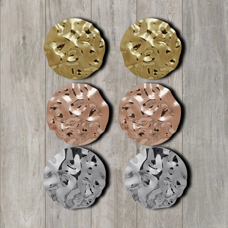 New fashion alloy earrings with irregular convex concave round studs in Europe and America
New fashion alloy earrings with irregular convex concave round studs in Europe and America