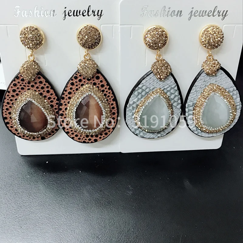 Hand inlaid with glittering and translucent cat eye drops earrings exaggerated large earring earrings
Hand inlaid with glittering and translucent cat eye drops earrings exaggerated large earring earrings
