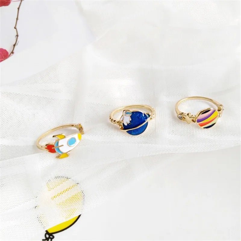 Fashion Cartoon Planet Astronaut Rocket Alloy Ring Cute Drop Oil Star Joint Ring Trendy Personality Jewelry Accessories Gift
Fashion Cartoon Planet Astronaut Rocket Alloy Ring Cute Drop Oil Star Joint Ring Trendy Personality Jewelry Accessories Gift