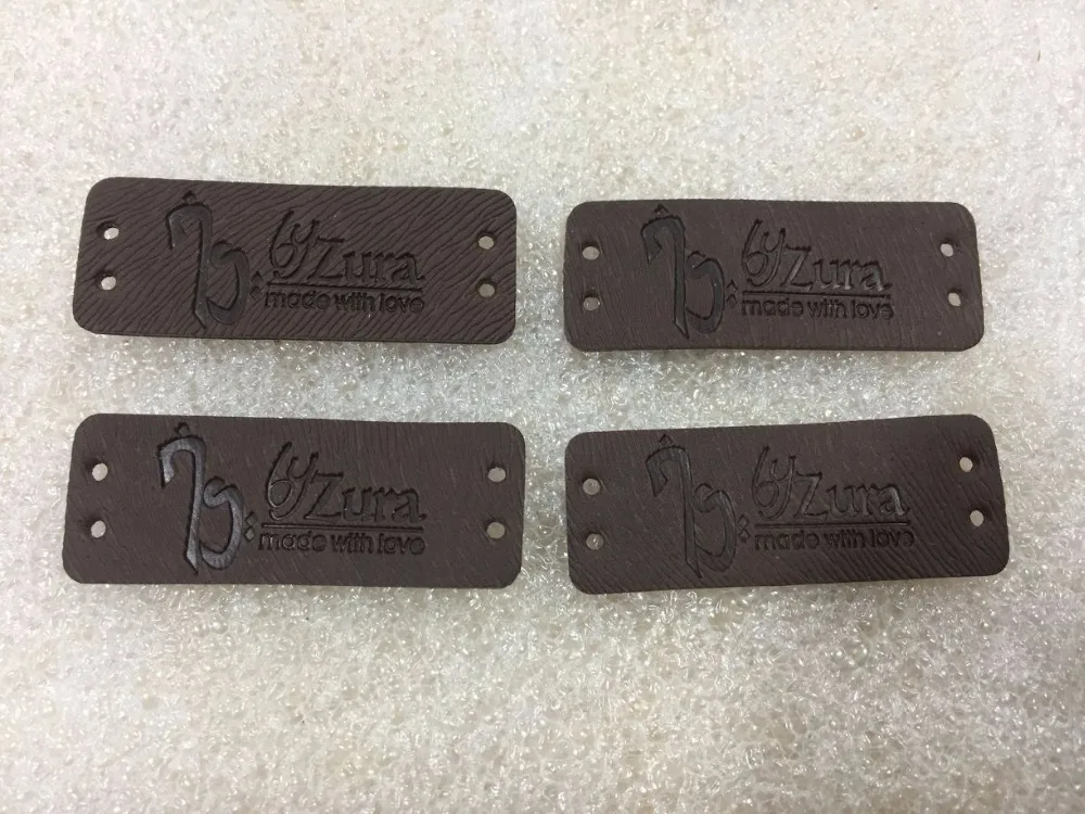 custom leather labels for jeans, bags, shoes in high quality, artificial leather label, debossed/engraved logo
custom leather labels for jeans, bags, shoes in high quality, artificial leather label, debossed/engraved logo