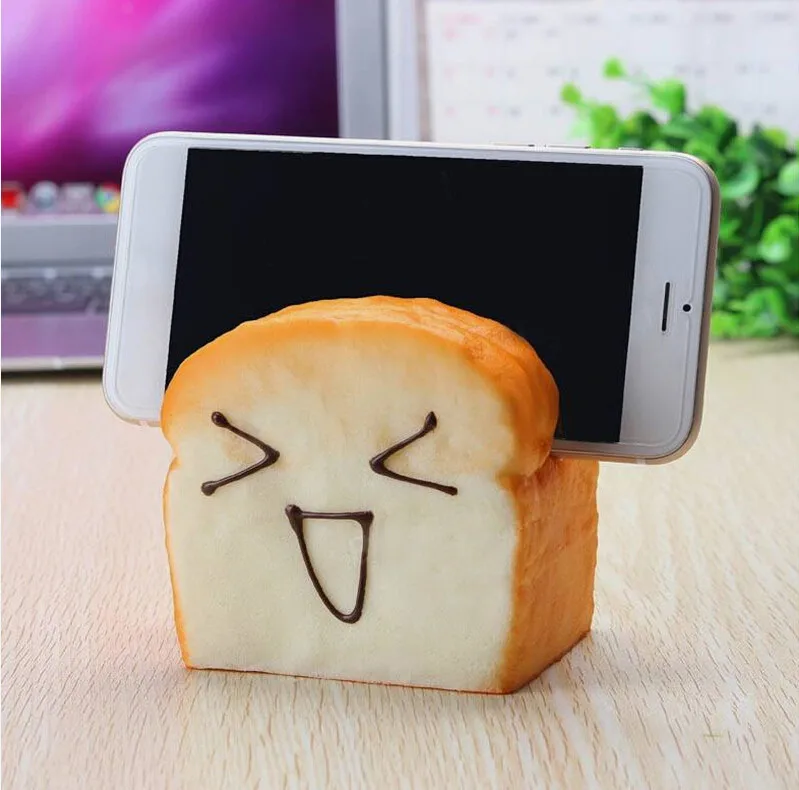 Slow Raising Slice Toast Joy Happy Faces Mobile Phone Seat Cellphone Holder Table Storage Holders Creative PU Storage Holders
Slow Raising Slice Toast Joy Happy Faces Mobile Phone Seat Cellphone Holder Table Storage Holders Creative PU Storage Holders