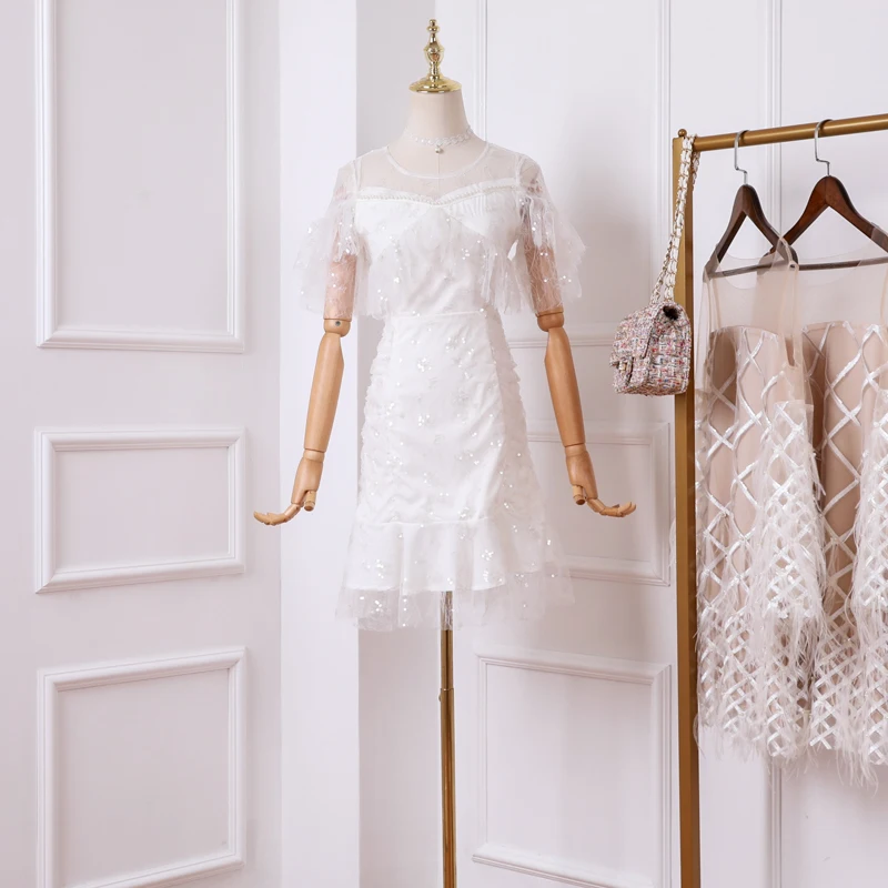 White 2019 new summer ladies temperament round neck beaded lotus leaf short sleeve sequin fishtail dress
White 2019 new summer ladies temperament round neck beaded lotus leaf short sleeve sequin fishtail dress