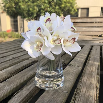 Real Touch Cymbidium 6 Heads Artificial Orchid Shoot Table Decoration Flower DIY Wedding Bride Hand Flowers Home Decor Floral 
Real Touch Cymbidium 6 Heads Artificial Orchid Shoot Table Decoration Flower DIY Wedding Bride Hand Flowers Home Decor Floral