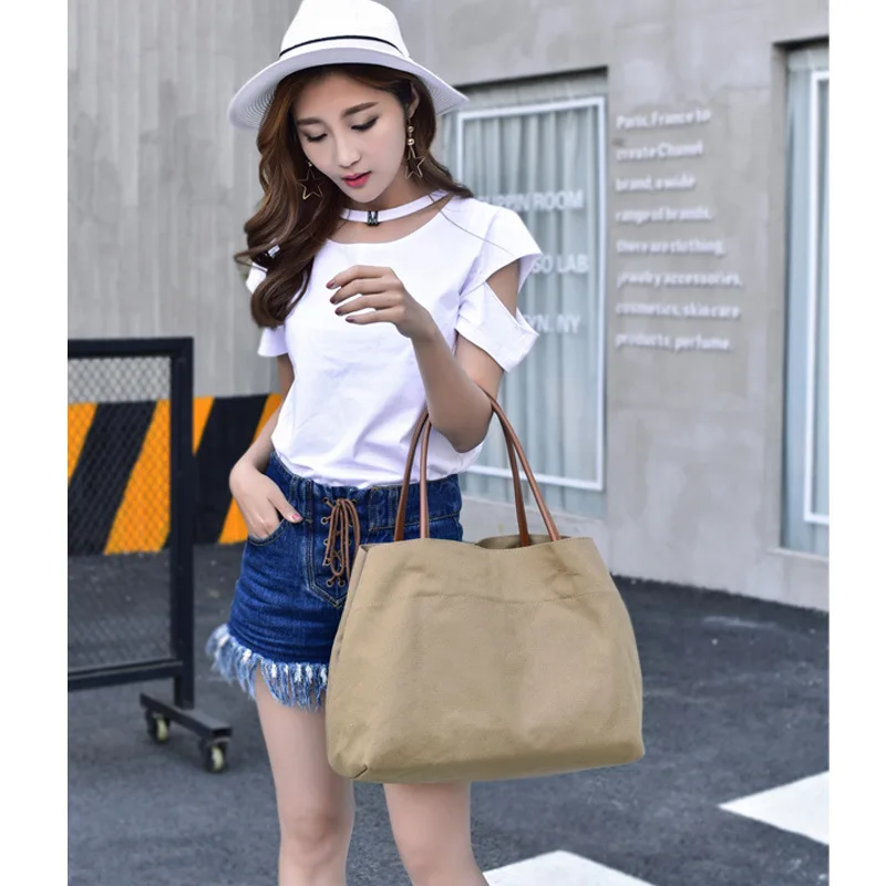 Very simple large-capacity portable single shoulder bag casual canvas female bag 
Very simple large-capacity portable single shoulder bag casual canvas female bag