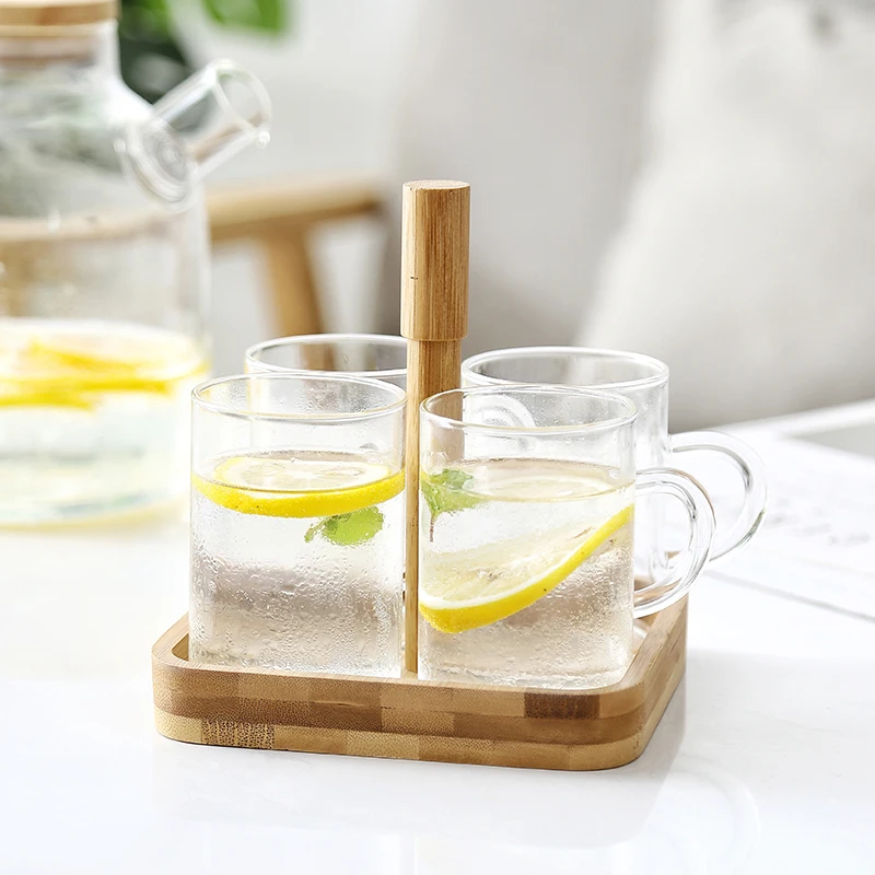 Fashion simple heat-resistant glass cup with bamboo cup holder tray household with handle hot water cup juice milk cup 4 sets
Fashion simple heat-resistant glass cup with bamboo cup holder tray household with handle hot water cup juice milk cup 4 sets