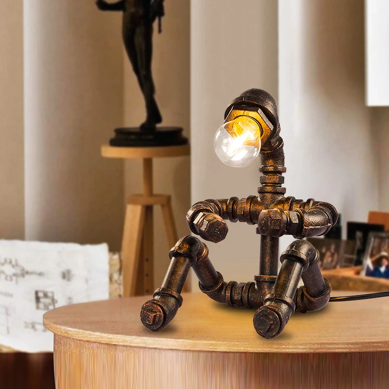 Creative water pipe robot vintage nostalgic eye bedside personalized small table lamp Industrial wind wrought iron lamp
Creative water pipe robot vintage nostalgic eye bedside personalized small table lamp Industrial wind wrought iron lamp